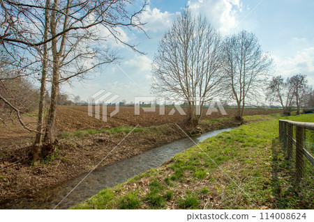 Plowed agricultural field 114008624