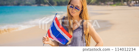 Happy woman having fun at the beach with Thailand flag. Beautiful girl enjoying travel to Asia BANNER, LONG FORMAT 114012234