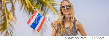 Happy woman having fun at the beach with Thailand flag. Beautiful girl enjoying travel to Asia BANNER, LONG FORMAT 114012240