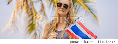 Happy woman having fun at the beach with Thailand flag. Beautiful girl enjoying travel to Asia BANNER, LONG FORMAT Happy woman having fun at the beach with Thailand flag. Beautiful girl enjoying travel to Asia BANNER, LONG FORMAT 114012247