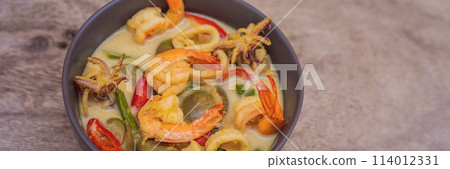 Thai food chicken green curry on dark wooden background. top view BANNER, LONG FORMAT 114012331