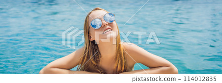 Young woman in outdoor swimming pool with city view in blue sky BANNER, LONG FORMAT Young woman in outdoor swimming pool with city view in blue sky BANNER, LONG FORMAT 114012835