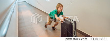 Funny little boy going on vacations trip with suitcase at airport, indoors BANNER, LONG FORMAT Funny little boy going on vacations trip with suitcase at airport, indoors BANNER, LONG FORMAT 114013369