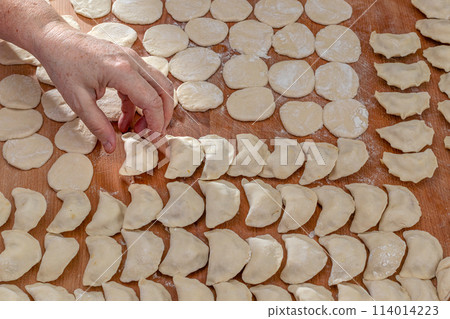 Beautiful rows with dumplings. Ukrainian national dish. Close-up.. 114014223
