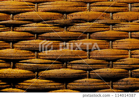 A weathered, aged straw basket texture (illustration-style retouching and color processing image) 114014387