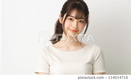 Female model standing in front of a white background 114014718