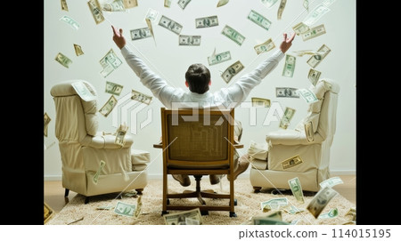 A man is sitting in a chair with his arms in the air, and money is falling from the sky. 114015195