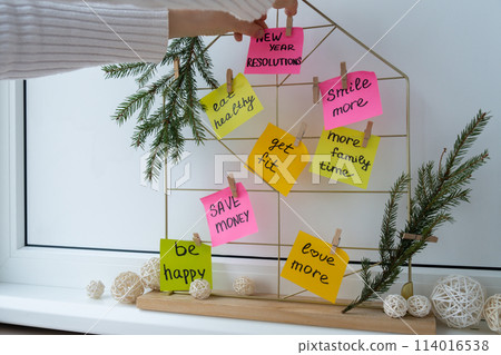Woman creating dream board promises and aims. Preparation for new year new life new me. Visualizing wish list for 2025. Dreams plan action resolutions for coming year. Inspirational self improvement Woman creating dream board promises and aims. Preparation for new year new life new me. Visualizing wish list for 2025. Dreams plan action resolutions for coming year. Inspirational self improvement 114016538