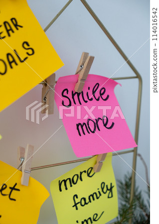 SMILE MORE self care goal on Action board new year's resolutions on colorful sticky notes. Making promises for new year, setting goals. Dream year SMILE MORE self care goal on Action board new year's resolutions on colorful sticky notes. Making promises for new year, setting goals. Dream year 114016542