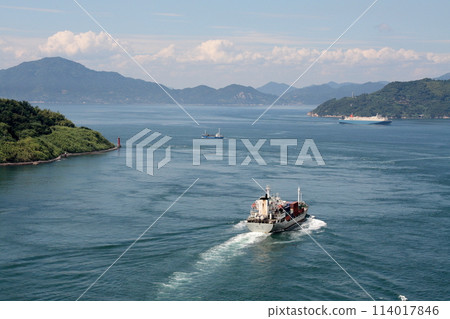A cargo ship heading to Sainan from the Kurushima Strait A cargo ship heading to Sainan from the Kurushima Strait 114017846