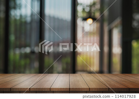 Empty wooden table top with lights bokeh on blur restaurant background. Empty wooden table top with lights bokeh on blur restaurant background. 114017928