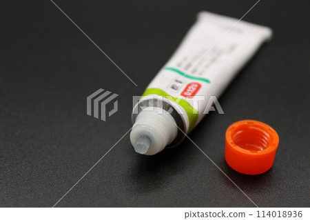 A partially used tube of ointment 114018936