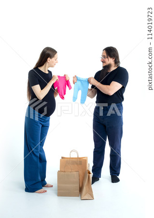pregnancy, shopping, parenthood and happiness concept - happy young family with shopping bags pregnancy, shopping, parenthood and happiness concept - happy young family with shopping bags 114019723