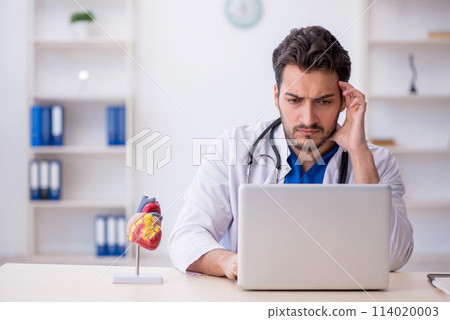 Young male doctor in telemedicine concept 114020003