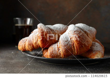 Croissants sprinkled with sugar powder. Croissants sprinkled with sugar powder. 114020615