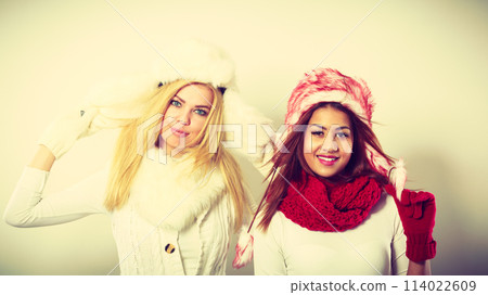 Two girls with winter outfit. Two girls with winter outfit. 114022609