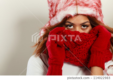 Woman with red winter clothing. Woman with red winter clothing. 114022983