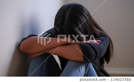 Depressed Woman Sitting Alone on the Floor in a Dark Room - Generative Ai 114023388