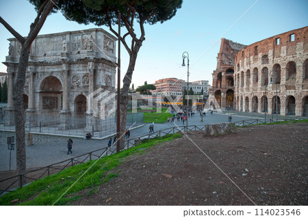 The Arch of Constantine and the Coliseum in Rome at twilight 114023546