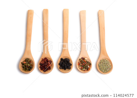 wooden spoon filled with various spices isolated on the white 114024577