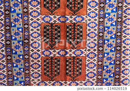 pattern of a traditional Arab carpet at oriental bazaar in Tashkent in Uzbekistan in close-up pattern of a traditional Arab carpet at oriental bazaar in Tashkent in Uzbekistan in close-up 114026519