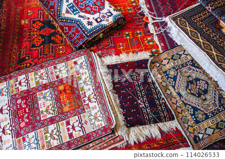 traditional oriental Turkmen handmade carpets at bazaar in Turkmenistan 114026533