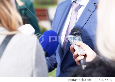 Journalists making media interview with business person or politician Journalists making media interview with business person or politician 114026689