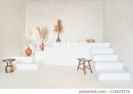 Minimalistic white steps on a white background. The perfect place to present your products. With space to copy. High quality photo Minimalistic white steps on a white background. The perfect place to present your products. With space to copy. High quality photo 114029376