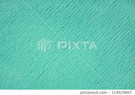 Turquioise knitted woolen jersey fabric with diagonal weaving, sweater, pullover texture background Turquioise knitted woolen jersey fabric with diagonal weaving, sweater, pullover texture background 114029667