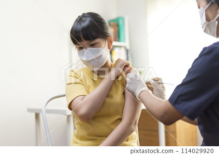Asian Preteen Girl Getting Vaccinated, Receiving Coronavirus Vaccine Injection in clinic. Asian Preteen Girl Getting Vaccinated, Receiving Coronavirus Vaccine Injection in clinic. 114029920