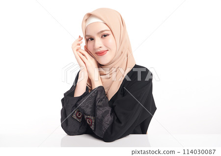 Beautiful young asian muslim woman wearing a beige hijab on white background, Portrait of Arab Beauty. 114030087