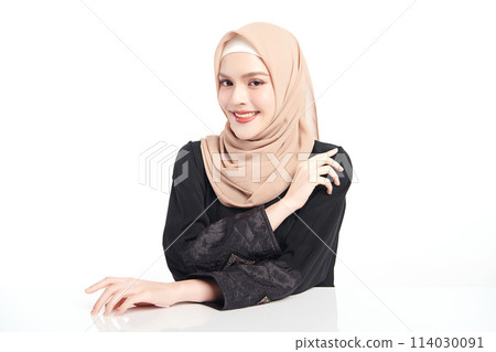 Beautiful young asian muslim woman wearing a beige hijab on white background, Portrait of Arab Beauty. 114030091