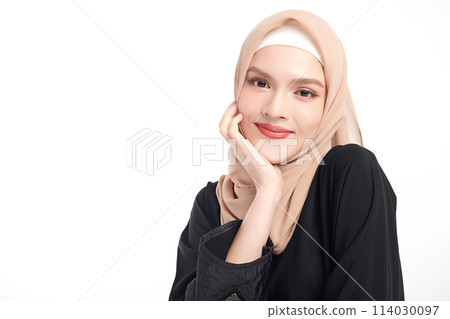 Beautiful young asian muslim woman wearing a beige hijab on white background, Portrait of Arab Beauty. 114030097