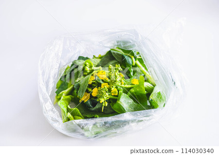 Washed rape blossoms in a plastic bag Washed rape blossoms in a plastic bag 114030340