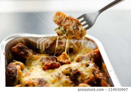 Fried potato fries coated  topped with mature cheddar and Monterey Jack cheeses, jalapeno and bacon sauce, finished with mozzarella and parsley 114030907