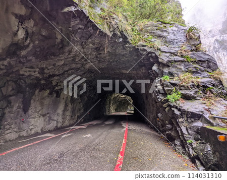Taroko, Taiwan - 11.26.2022: Empty and wet Swallow Grotto Trail passing through marble cliffs on a rainy day before the 403 earthquake during the pandemic 114031310
