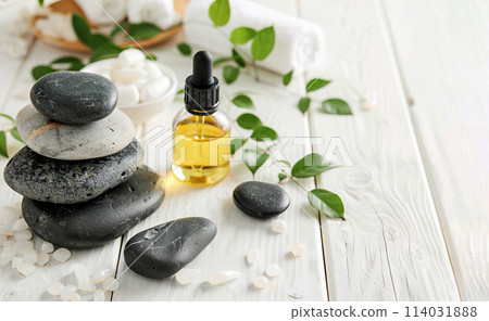 Beautiful spa composition with stones and oil bottles on wooden background Beautiful spa composition with stones and oil bottles on wooden background 114031888