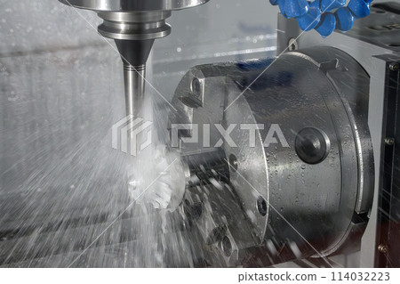 The 4-axis CNC milling machine  cutting the turbocharger part with liquid coolant method. 114032223