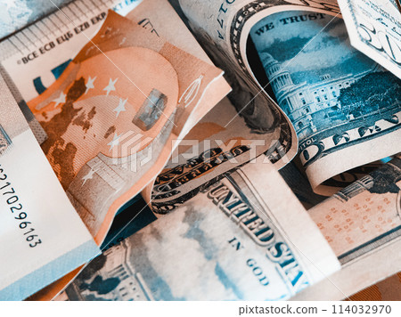 A mix of Euro and US Dollar bills in various denominations. A mix of Euro and US Dollar bills in various denominations. 114032970
