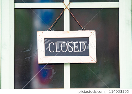 sorry we are closed sign hanging outside a restaurant, store, office or other sorry we are closed sign hanging outside a restaurant, store, office or other 114033305