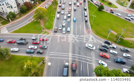 Congestion at an intersection during rush hour, aerial view, blurred motion of moving cars Congestion at an intersection during rush hour, aerial view, blurred motion of moving cars 114033491