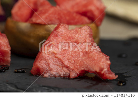 sliced into pieces of red ripe watermelon sliced into pieces of red ripe watermelon 114034110