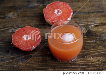 Juicy red grapefruit on the table Juicy red grapefruit on the table 114034449