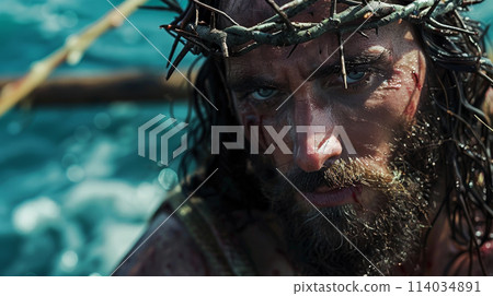 A man with a crown on his head and blood on his face 114034891
