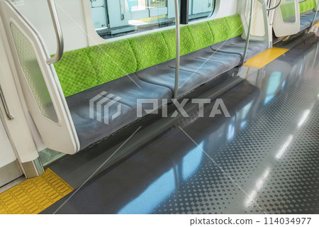 Train seen from inside the car, Train stopping at the platform, Yamanote Line, Priority seats, Inside the car (E235 series) 114034977