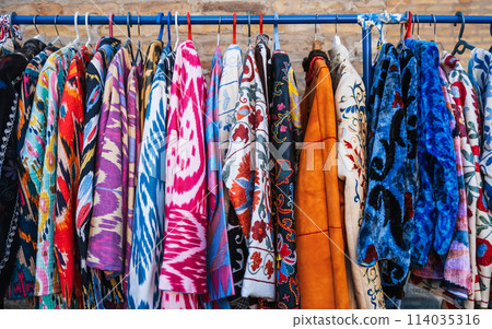 bright colorful traditional Arab Turkish dresses at oriental street bazaar in Turkey bright colorful traditional Arab Turkish dresses at oriental street bazaar in Turkey 114035316