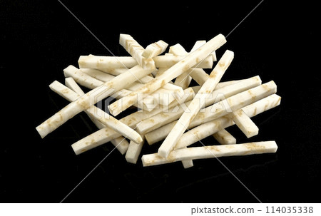 Chopped celery root isolated on black background Chopped celery root isolated on black background 114035338