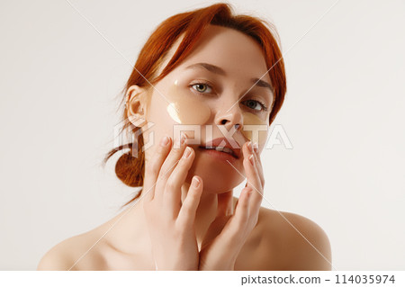 Smiling woman take-off under eye collagen patches Smiling woman take-off under eye collagen patches 114035974