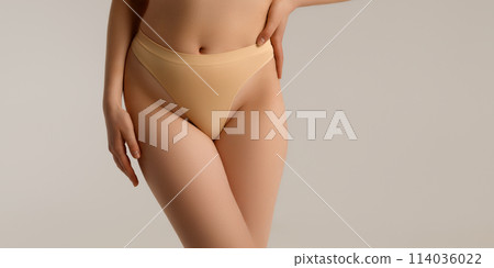 Perfect body. Slim caucasian lady posing showing Perfect body. Slim caucasian lady posing showing 114036022