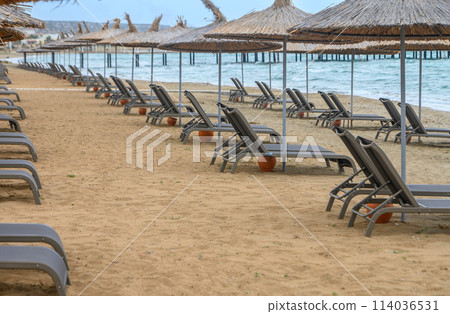 Mediterranean beach with sun loungers and sun umbrellas 4 Mediterranean beach with sun loungers and sun umbrellas 4 114036531